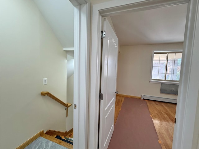 1604 Robertson Pl, Bronx, NY 10465 - corridor with a baseboard radiator, wood finished floors, and an upstairs landing
