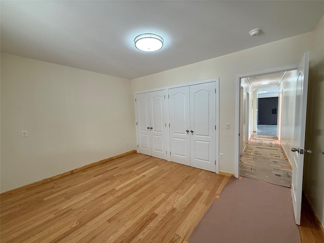 1604 Robertson Pl, Bronx, NY 10465 - unfurnished bedroom featuring two closets and light wood-style floors