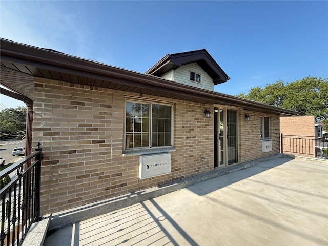 1604 Robertson Pl, Bronx, NY 10465 - rear view of house with brick siding and a patio area