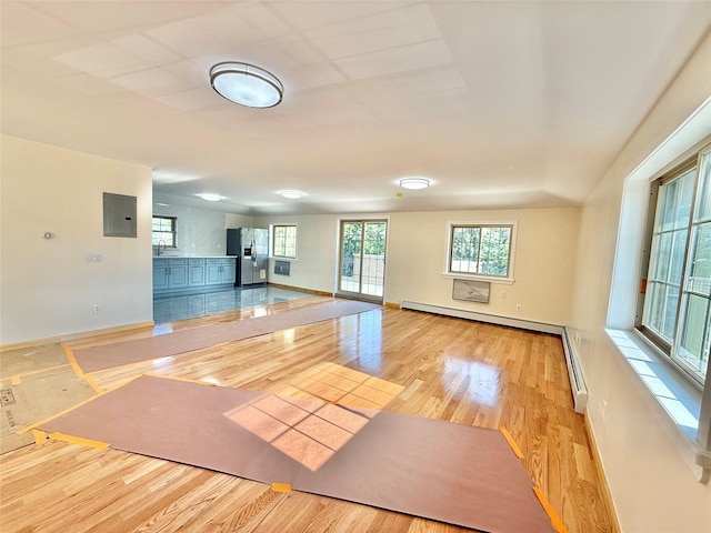 1604 Robertson Pl, Bronx, NY 10465 - unfurnished living room with electric panel, wood finished floors, a baseboard radiator, and baseboard heating