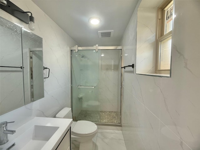 1604 Robertson Pl, Bronx, NY 10465 - bathroom featuring tile walls, marble look tiles, vanity, and a marble finish shower