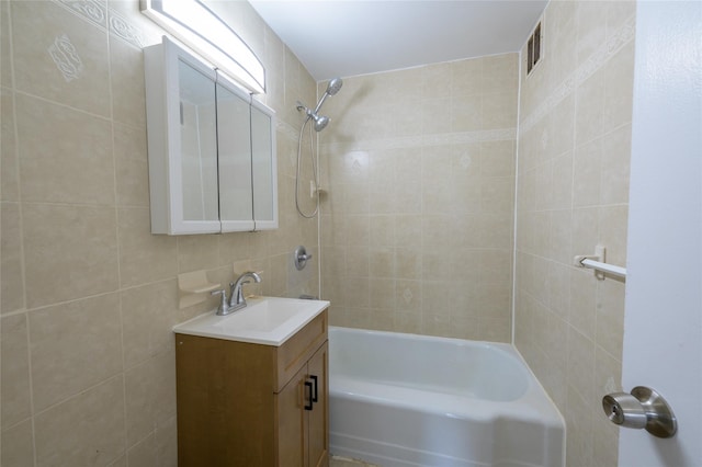 610 Waring Ave Unit 5F, Bronx, NY 10467 - bathroom with vanity, shower / washtub combination, and tile walls