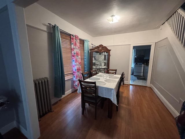 1492 E 45th St, Brooklyn, NY 11234 - dining space featuring radiator heating unit and wood finished floors