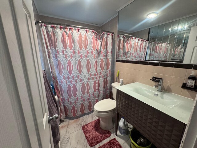 1492 E 45th St, Brooklyn, NY 11234 - full bathroom with tile walls, vanity, ornamental molding, and shower / tub combo