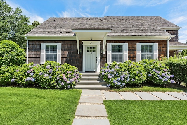63 Armande St, Southampton, NY 11968 - view of front of home with a front yard