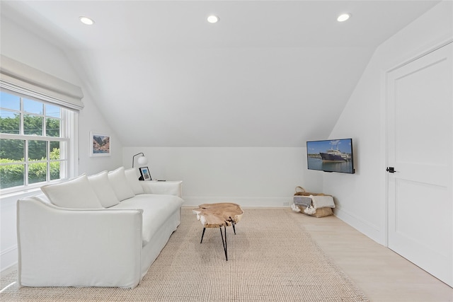 63 Armande St, Southampton, NY 11968 - living area with lofted ceiling, wood finished floors, and recessed lighting