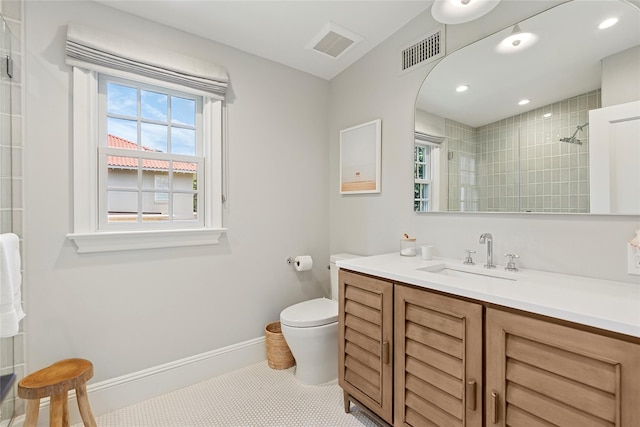 63 Armande St, Southampton, NY 11968 - bathroom with vanity, a tile shower, and recessed lighting