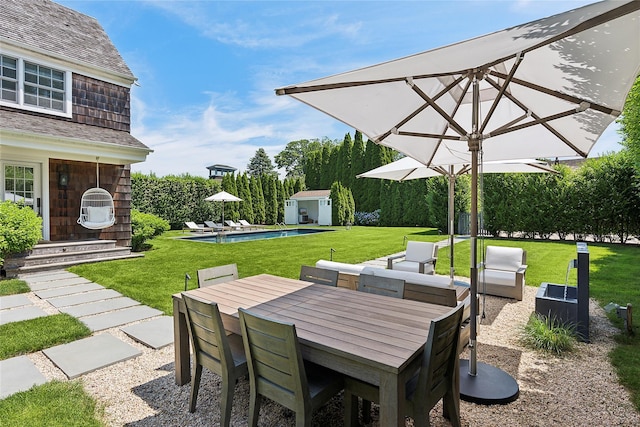 63 Armande St, Southampton, NY 11968 - view of patio featuring an outdoor structure and outdoor dining space