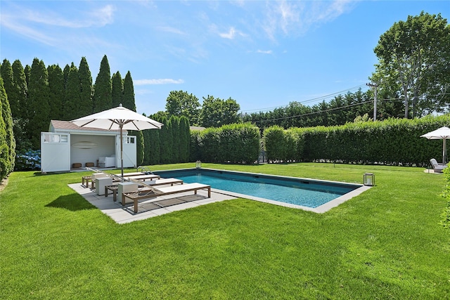 63 Armande St, Southampton, NY 11968 - view of pool featuring a lawn, a patio area, and an outbuilding