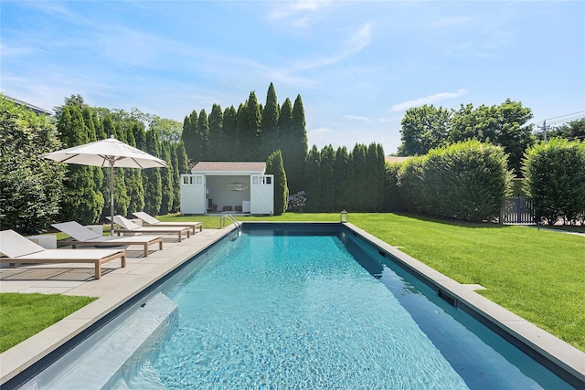 63 Armande St, Southampton, NY 11968 - view of pool featuring an outbuilding, a patio area, and a storage structure