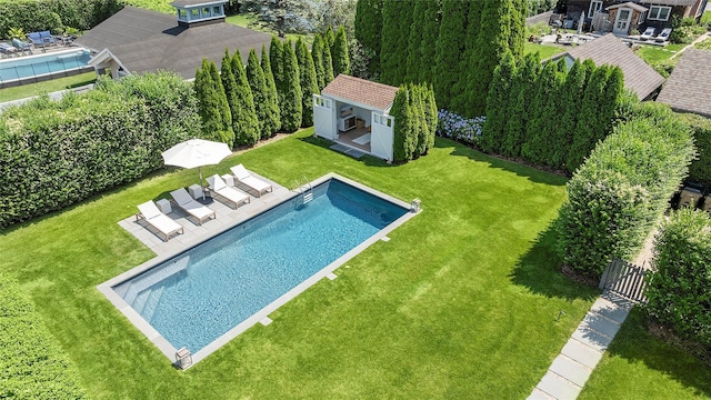 63 Armande St, Southampton, NY 11968 - swimming pool with an exterior structure, an outbuilding, and a patio