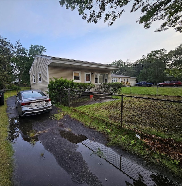 83 Priscilla Ave, Riverhead, NY 11901 - view of front of home featuring asphalt driveway and a water view