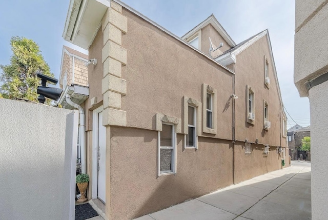 2144 73rd St, Astoria, NY 11370 - view of property exterior featuring stucco siding