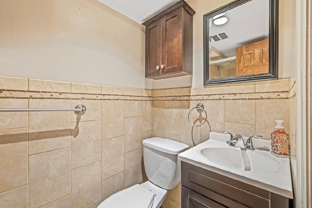 2144 73rd St, Astoria, NY 11370 - bathroom featuring vanity, wainscoting, and tile walls
