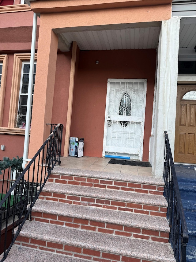 1380 Bristow St, Bronx, NY 10459 - property entrance featuring stucco siding