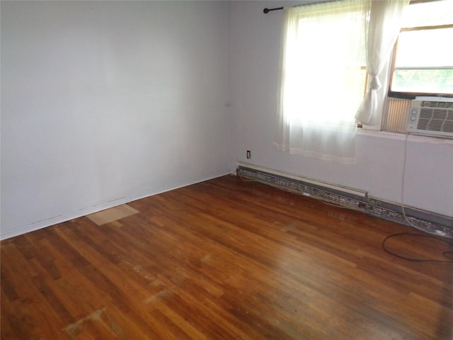 31 Marine Ave W, Lindenhurst, NY 11757 - spare room with wood finished floors, a baseboard heating unit, and cooling unit