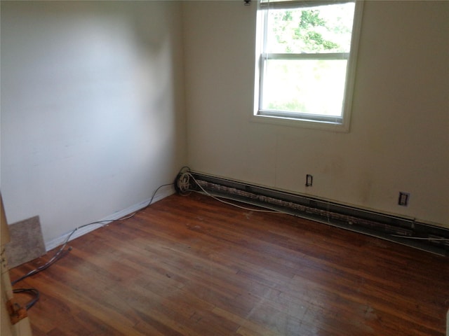 31 Marine Ave W, Lindenhurst, NY 11757 - empty room featuring wood finished floors and a baseboard heating unit