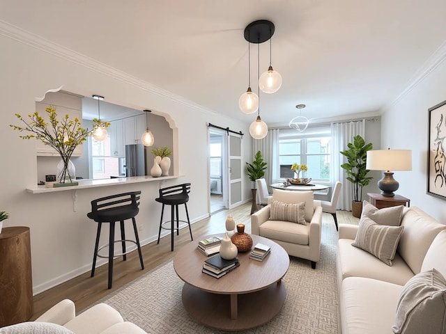800 Grand Concourse Unit 2Js, Bronx, NY 10451 - living area with a barn door, ornamental molding, wood finished floors, and a chandelier