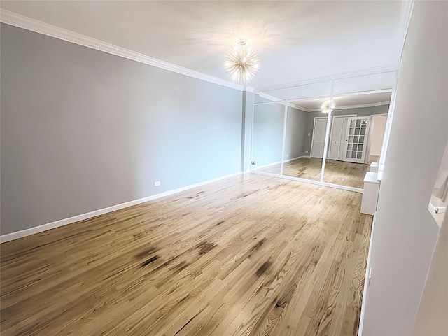 800 Grand Concourse Unit 2Js, Bronx, NY 10451 - unfurnished bedroom with crown molding, light wood finished floors, and a closet