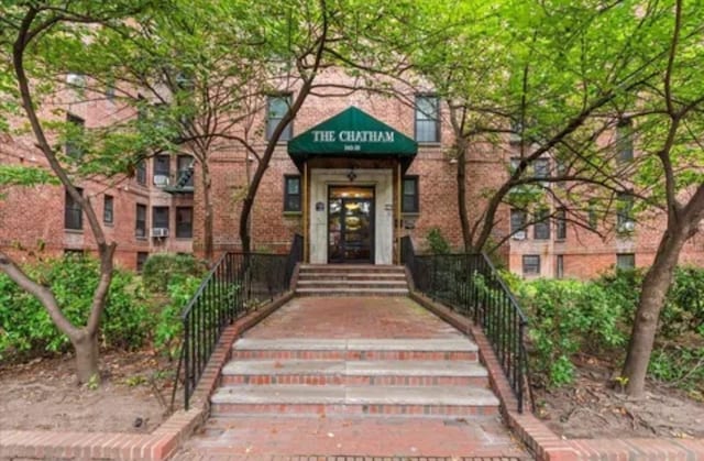 14018 Burden Cres Unit 410, Briarwood, NY 11435 - view of exterior entry featuring brick siding