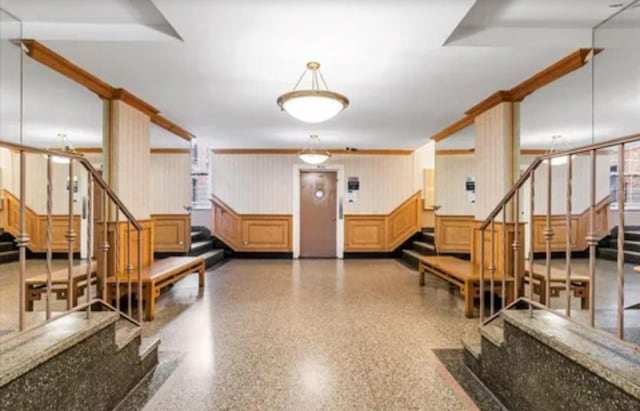 14018 Burden Cres Unit 410, Briarwood, NY 11435 - building lobby with stairway, wainscoting, and a decorative wall