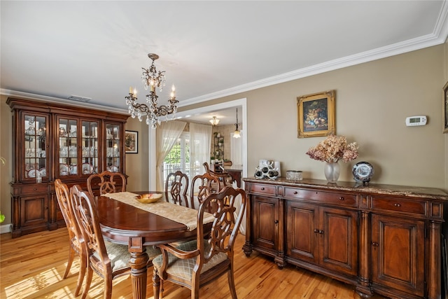 150 Hortontown Rd, Carmel, NY 10512 - dining space with a chandelier, light wood-style floors, and crown molding
