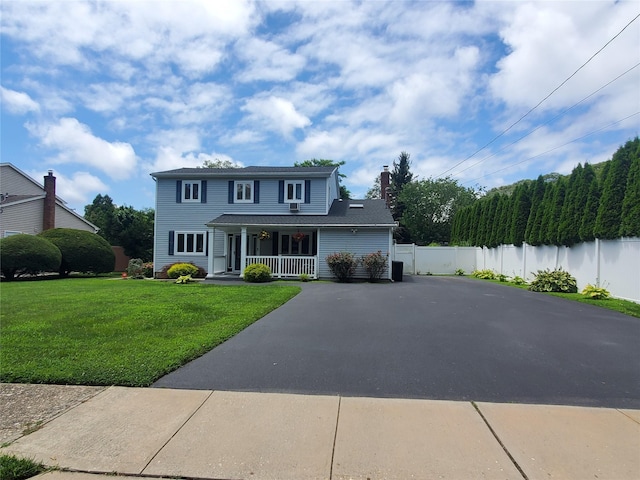 1336 Coates Ave, Holbrook, NY 11741 - traditional-style home with covered porch, driveway, and a chimney