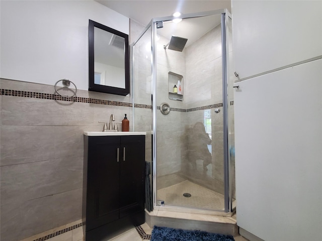 1336 Coates Ave, Holbrook, NY 11741 - bathroom with a stall shower, vanity, and tile walls
