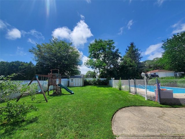 1336 Coates Ave, Holbrook, NY 11741 - view of yard featuring a storage unit and a playground
