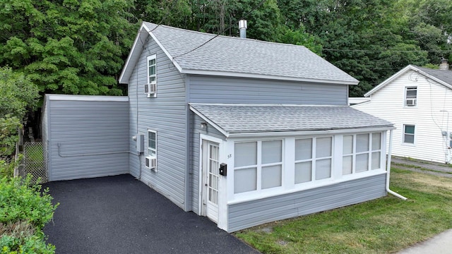58 Wawayanda Ave, Middletown, NY 10940 - view of home's exterior featuring roof with shingles, a yard, and asphalt driveway