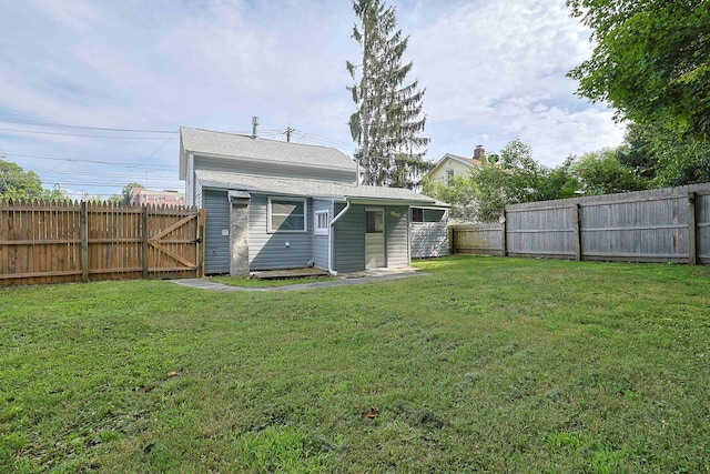 58 Wawayanda Ave, Middletown, NY 10940 - rear view of house with a fenced backyard and a gate