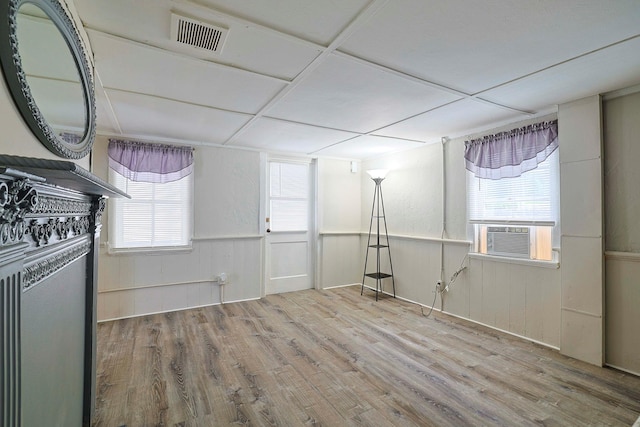 58 Wawayanda Ave, Middletown, NY 10940 - below grade area with wood finished floors, a wainscoted wall, and cooling unit