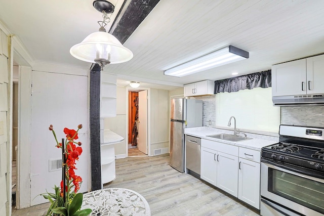 58 Wawayanda Ave, Middletown, NY 10940 - kitchen with appliances with stainless steel finishes, extractor fan, light wood-style floors, and white cabinets