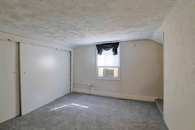 58 Wawayanda Ave, Middletown, NY 10940 - additional living space with carpet floors, lofted ceiling, cooling unit, and a textured ceiling