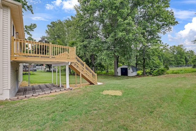 30 Wilson St, Middletown, NY 10940 - view of grassy yard featuring a storage unit, stairs, and a deck
