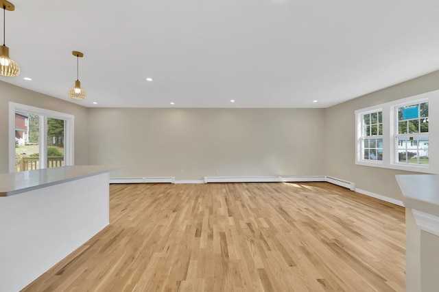 30 Wilson St, Middletown, NY 10940 - unfurnished living room with light wood-style flooring, recessed lighting, and baseboard heating