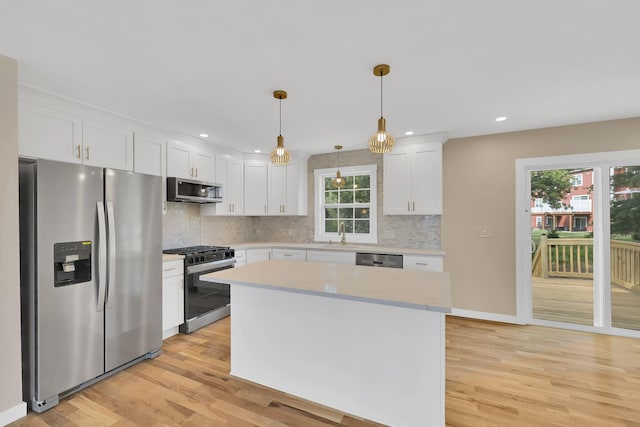 30 Wilson St, Middletown, NY 10940 - kitchen featuring appliances with stainless steel finishes, light wood-style floors, healthy amount of natural light, white cabinets, and recessed lighting