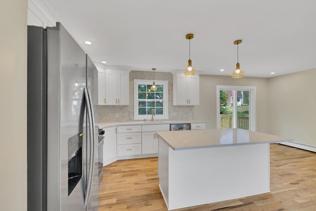 30 Wilson St, Middletown, NY 10940 - kitchen featuring appliances with stainless steel finishes, white cabinets, plenty of natural light, decorative backsplash, and recessed lighting