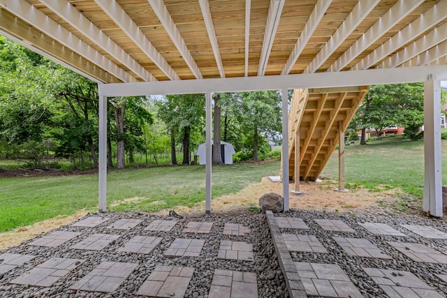 30 Wilson St, Middletown, NY 10940 - view of patio with a storage shed and view of wooded area