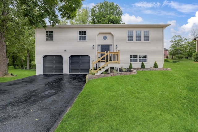 30 Wilson St, Middletown, NY 10940 - split foyer home featuring an attached garage, asphalt driveway, and a front yard