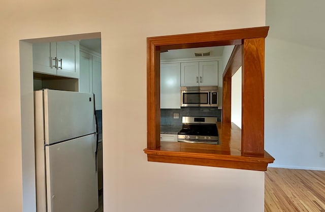 15 Blue Hill Commons, Orangeburg, NY 10962 - kitchen with stainless steel appliances, tasteful backsplash, and light wood finished floors