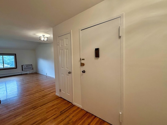 15 Blue Hill Commons, Orangeburg, NY 10962 - entryway featuring baseboard heating, wood finished floors, a wall mounted AC, and lofted ceiling