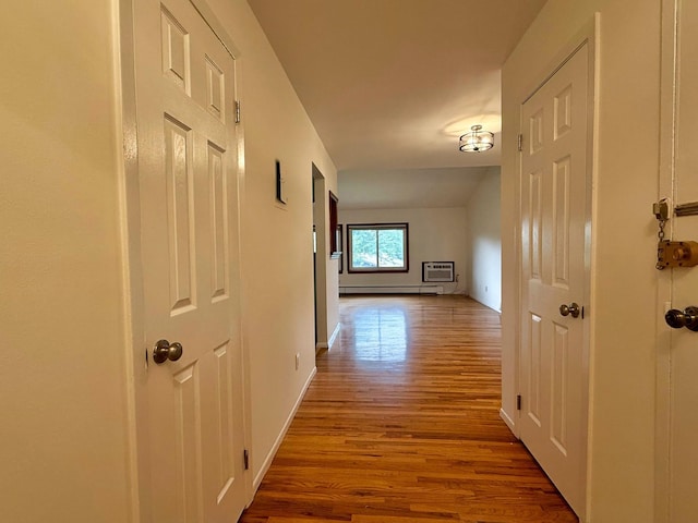 15 Blue Hill Commons, Orangeburg, NY 10962 - corridor with wood finished floors, an AC wall unit, and baseboard heating