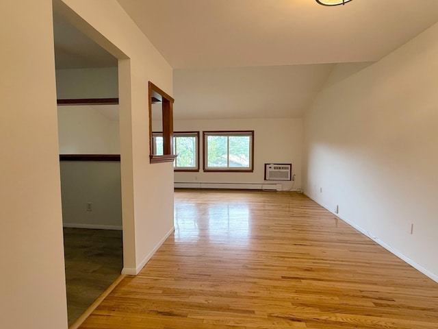 15 Blue Hill Commons, Orangeburg, NY 10962 - bonus room with a baseboard heating unit, light wood-type flooring, an AC wall unit, and vaulted ceiling
