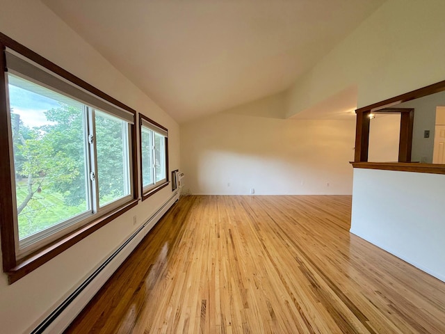 15 Blue Hill Commons, Orangeburg, NY 10962 - spare room with baseboard heating, light wood finished floors, and vaulted ceiling