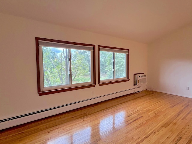 15 Blue Hill Commons, Orangeburg, NY 10962 - empty room featuring a baseboard radiator, plenty of natural light, light wood finished floors, and a wall mounted AC
