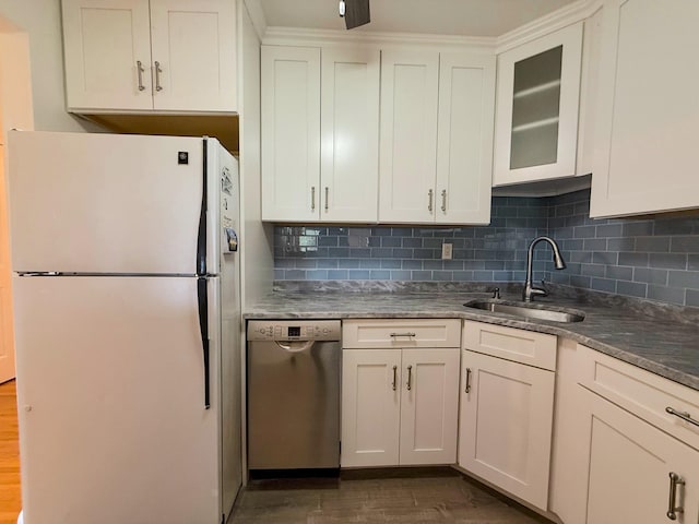 15 Blue Hill Commons, Orangeburg, NY 10962 - kitchen featuring freestanding refrigerator, stainless steel dishwasher, dark wood-style floors, backsplash, and white cabinetry