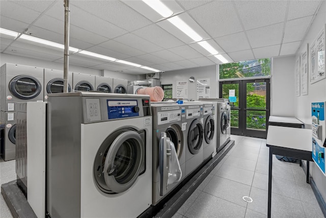 301 W 110th St Unit 2V, New York Manhattan, NY 10026 - shared laundry featuring washing machine and dryer and tile patterned flooring