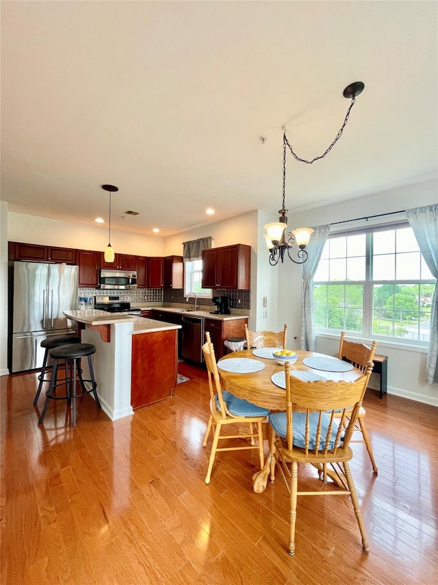 936 Tower Ridge Cir, Middletown, NY 10941 - dining area featuring healthy amount of natural light, light wood-style flooring, recessed lighting, and a chandelier