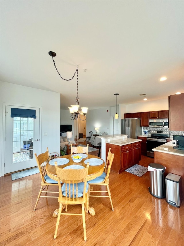 936 Tower Ridge Cir, Middletown, NY 10941 - dining space with a chandelier, light wood-style flooring, and recessed lighting